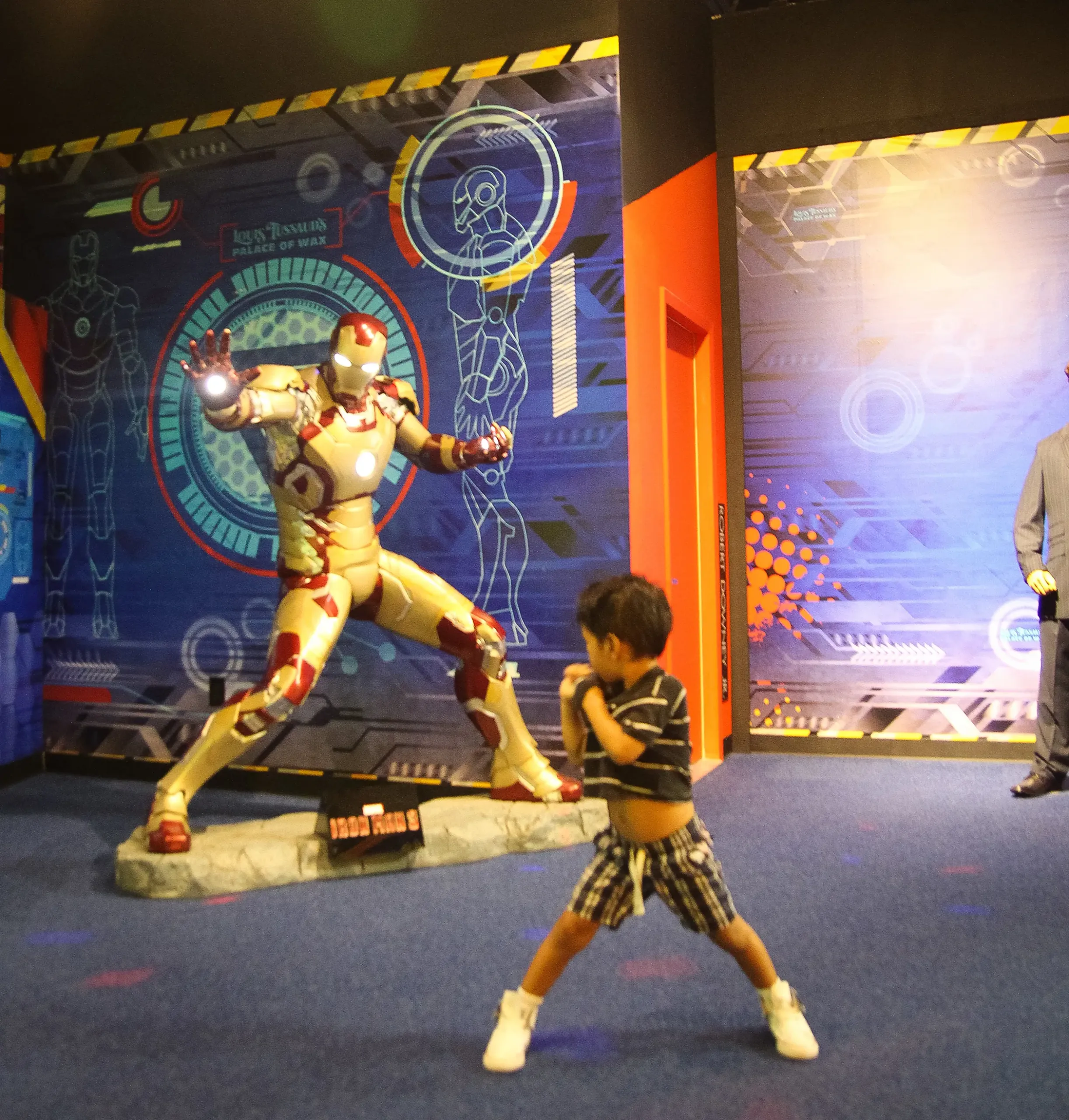 dg-grandprairie-001 Kid standing in front of Iron Man in Grand Prairie Texas